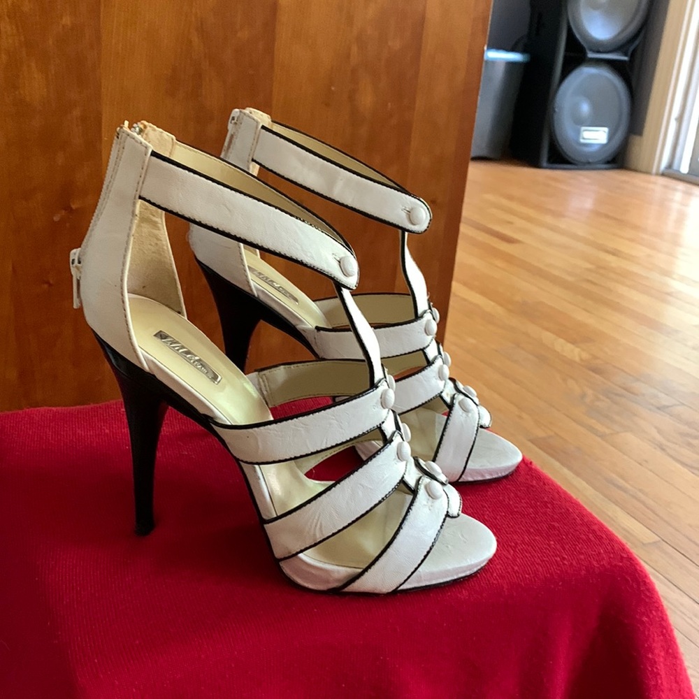 Black and white heels with a black heel, some wear and tear